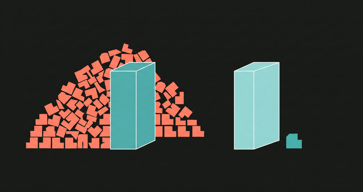 An abstract illustration on a near-black ground: a teal block half buried in a large heap of small coral shapes, and a second teal block some distance away with only one tiny shape beside it.